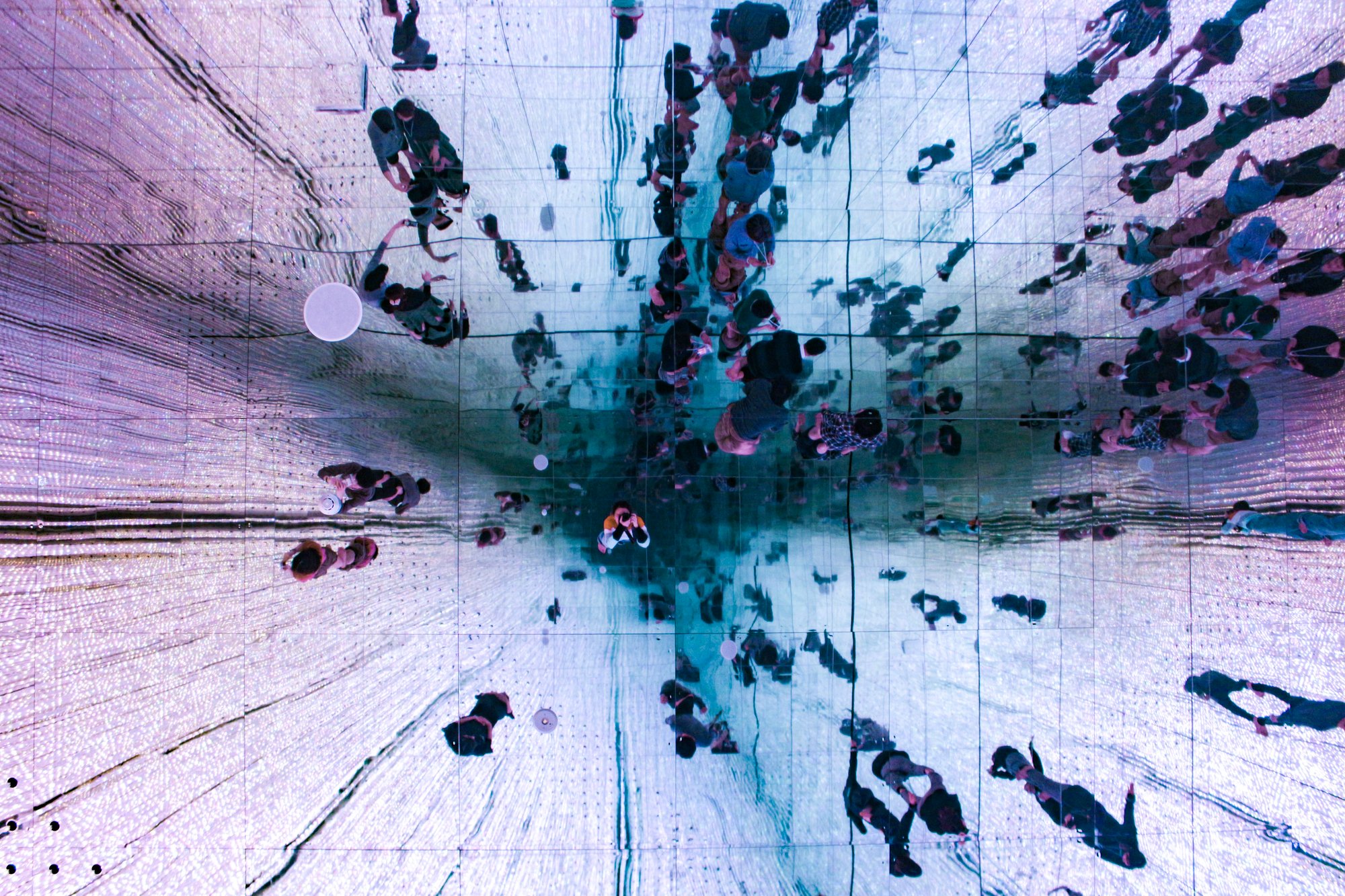 low-angle-view-of-ceiling-mirror-showing-people-s-2026-01-07-01-51-17-utc