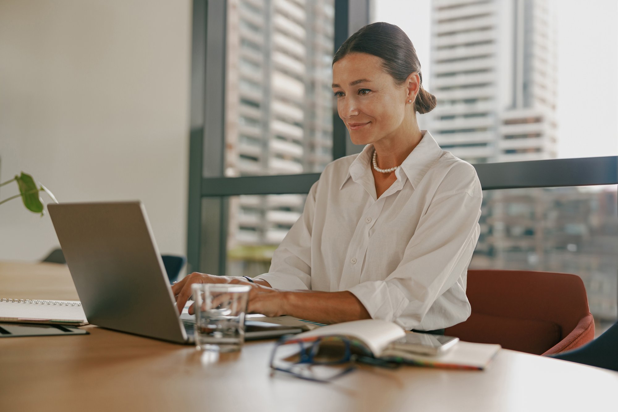 a-professional-woman-is-in-a-modern-workspace-2026-01-07-01-03-14-utc