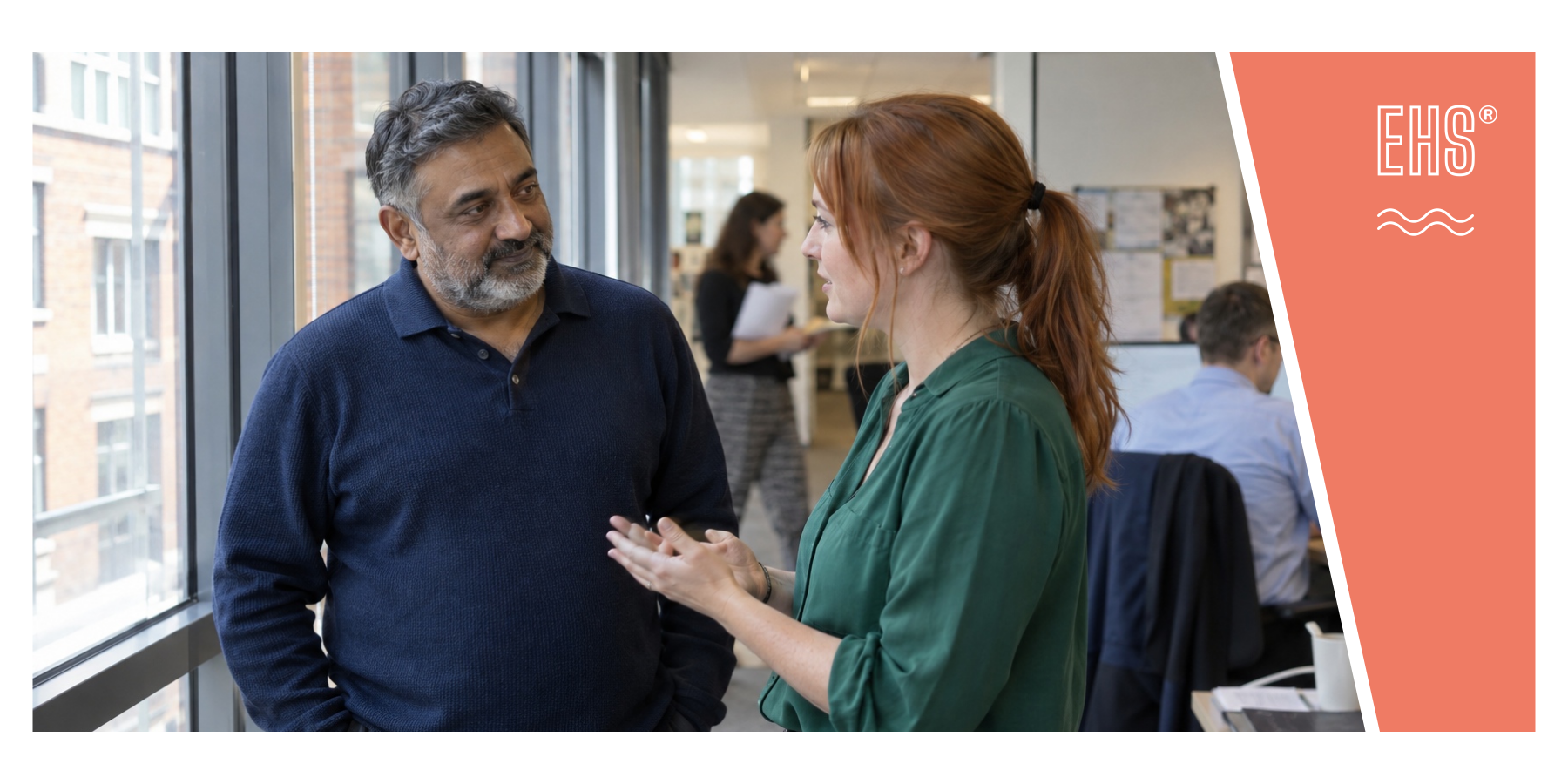 Two colleagues discussing a concern at work with EHS branding