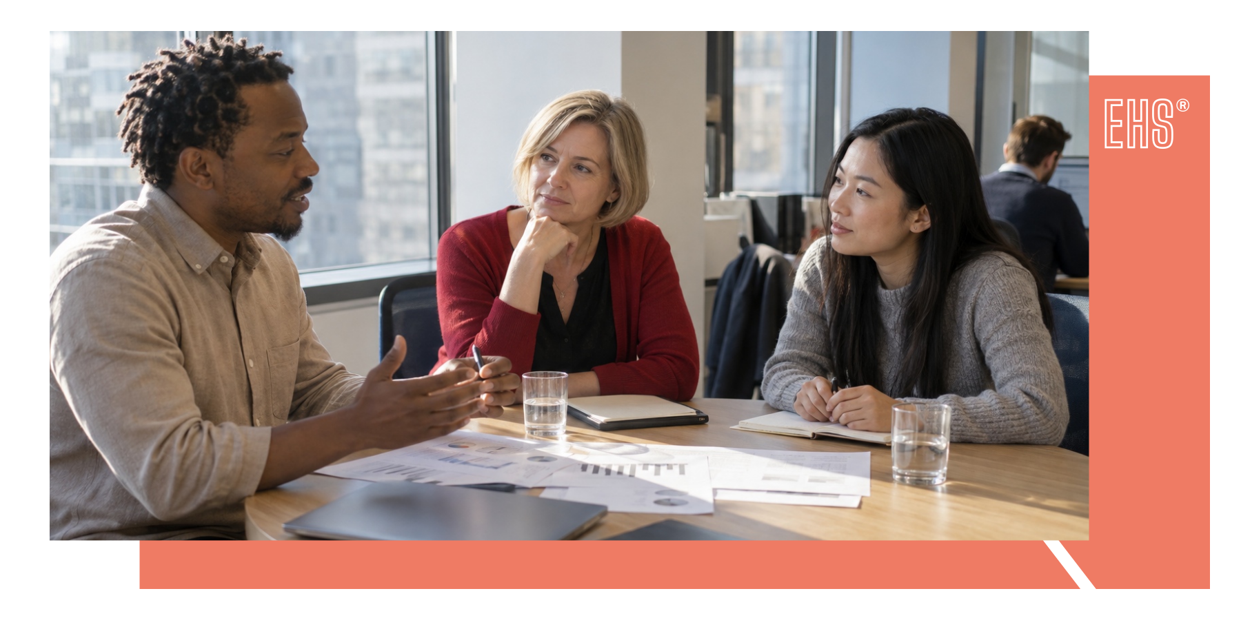 Three colleagues discussing results around a table with EHS branding