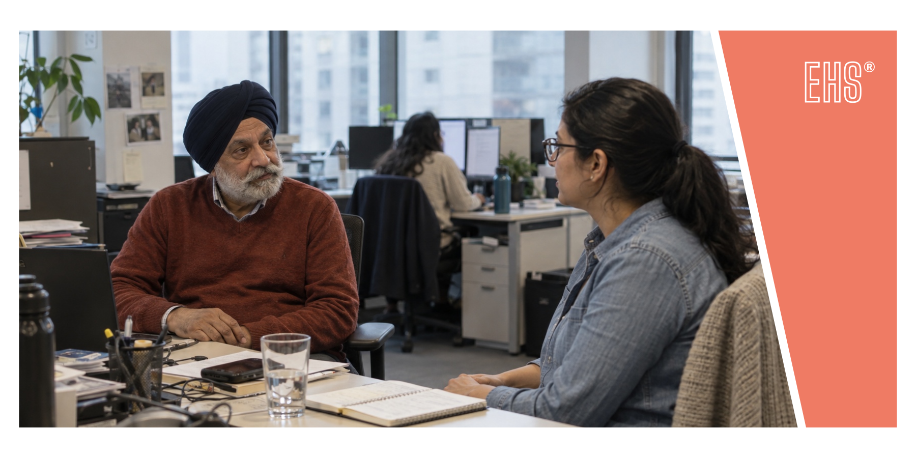 Colleagues listening to each other during an office conversation with EHS branding